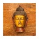 Brass Buddha on Wooden Panel Brass Buddha on Wooden Panel