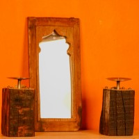 Wooden mirror frame in reclaimed wood with a natural distressed finish, suitable for rustic interiors.