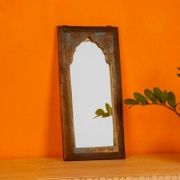 Handcrafted mirror frame made from reclaimed wood with natural textures and a rustic finish.