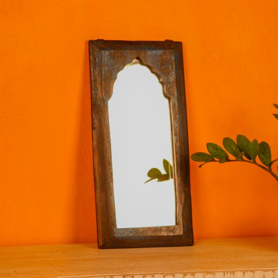 Handcrafted mirror frame made from reclaimed wood with natural textures and a rustic finish.