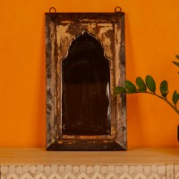 Handcrafted mirror frame made from reclaimed wood with natural textures and a rustic finish.