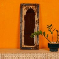 Wooden mirror frame crafted from reclaimed wood showcasing unique grains and an aged finish.