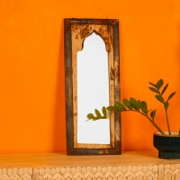 Wooden mirror frame crafted from reclaimed wood showcasing unique grains and an aged finish.