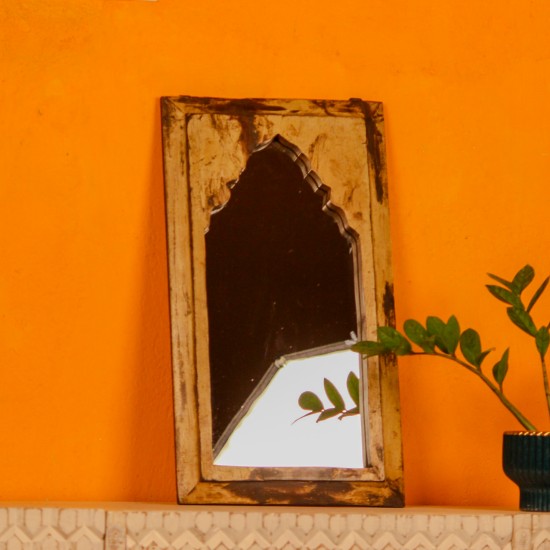 Handcrafted mirror frame made from reclaimed wood with natural textures and a rustic finish.