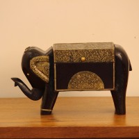 Dark wooden elephant-shaped decorative box with gold detailing and four sturdy legs.
