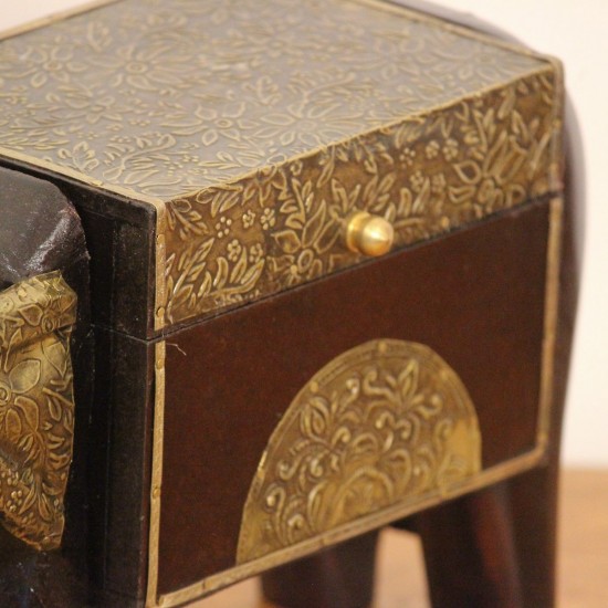 Dark wooden elephant-shaped decorative box with gold detailing and four sturdy legs.