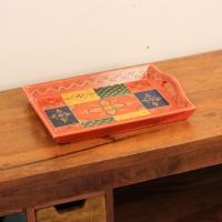 Coral-coloured rectangular tray featuring colourful geometric patterns and traditional floral artwork.