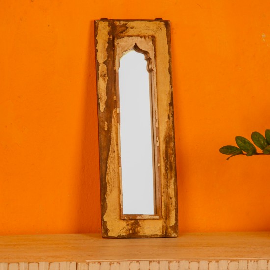 Handcrafted mirror frame made from reclaimed wood with natural textures and a rustic finish.