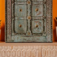 Blue green handcrafted wooden door wall panel with carved detailing and antique metal studs for rustic Indian wall decor