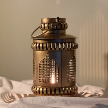 Handmade iron Gajra lantern in golden matte finish with intricate perforated design, suitable for wall-mounted ambient lighting