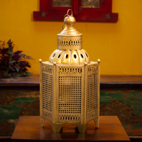 Iron perforated golden hanging lantern – metal lantern for home décor front view Iron perforated golden hanging lantern – metal lantern for home décor front view