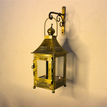 Traditional Indian iron hanging lantern with transparent glass panels and golden polish, ideal for Diwali and spiritual home décor