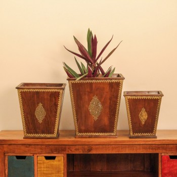  Brown polished wooden planter pot featuring intricate brass embossed border and handcrafted detailing