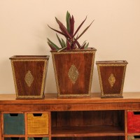 Set of 3 Wooden Planter Pot with Brass Embossed Detailing Brown polished wooden planter pot featuring intricate brass embossed border and handcrafted detailing