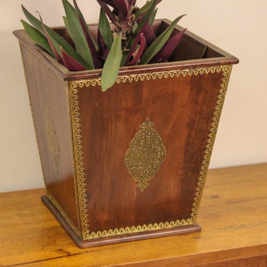 Brown polished wooden planter pot featuring intricate brass embossed border and handcrafted detailing