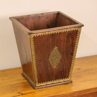 Brown polished wooden planter pot featuring intricate brass embossed border and handcrafted detailing