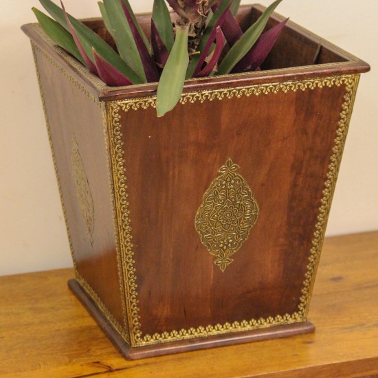 Brown polished wooden planter pot featuring intricate brass embossed border and handcrafted detailing