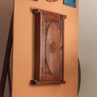 Antique Finish Old Window Style Wooden Cabinet Polished wooden cabinet designed like an old window with carved detailing and antique finish
