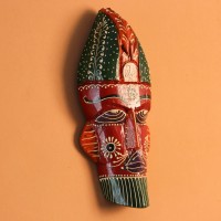 Hand Painted Tribal Face Mask – Red Hand-carved wooden tribal face mask hand painted in red with a green striped crown, purple diamond eyes, and detailed facial motifs in orange and white.