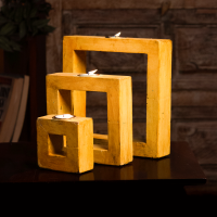 Yellow square tea-light holder set of 3 – decorative candle stands front view Yellow square tea-light holder set of 3 – decorative candle stands front view