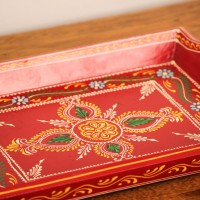 Hand Painted Red Wooden Tray – Small (12" x 8") – Front View Hand painted Red coloFront view of a small 12 x 8 inch hand-painted red wooden serving tray with floral centre motifred wooden tray - Small