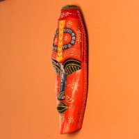 Hand Painted Tribal Face Mask – Orange Mandala Large hand-carved wooden tribal face mask hand painted in bright orange with navy and mustard accents, a dotted mandala border, and fine white floral detailing across the face.