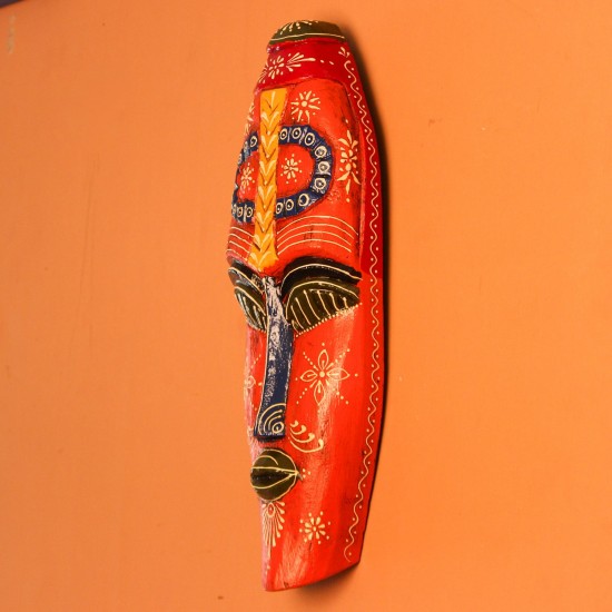 Hand Painted Tribal Face Mask – Orange Mandala Large hand-carved wooden tribal face mask hand painted in bright orange with navy and mustard accents, a dotted mandala border, and fine white floral detailing across the face.