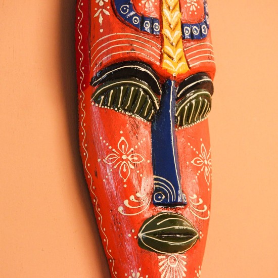 Hand Painted Tribal Face Mask – Orange Mandala Large hand-carved wooden tribal face mask hand painted in bright orange with navy and mustard accents, a dotted mandala border, and fine white floral detailing across the face.