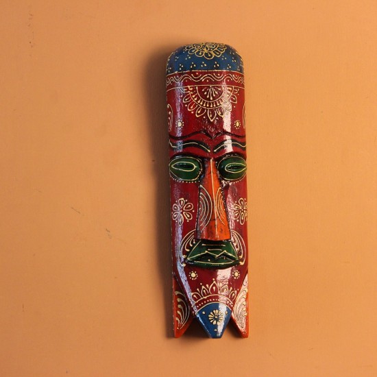 Hand Painted Tribal Face Mask – Maroon Mandala Hand-carved wooden tribal face mask in an elongated form, hand painted in maroon with a mandala-bordered crown, green eyes, and fine white floral detailing.
