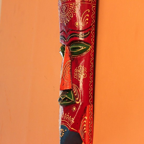 Hand Painted Tribal Face Mask – Maroon Mandala Hand-carved wooden tribal face mask in an elongated form, hand painted in maroon with a mandala-bordered crown, green eyes, and fine white floral detailing.