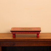Hand Painted Mandala Chowki – Red, Large Large wooden chowki hand painted in red with a detailed mandala centrepiece in blue and gold, bordered by fine floral and paisley motifs along the edges.