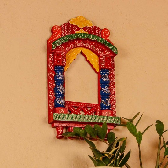 Colorful handpainted wooden jharokha frame with red, blue, and yellow detailing, inspired by traditional Indian architecture.