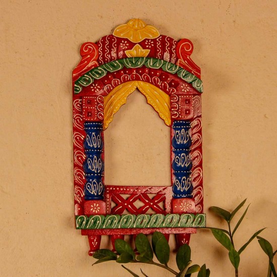 Colorful handpainted wooden jharokha frame with red, blue, and yellow detailing, inspired by traditional Indian architecture.
