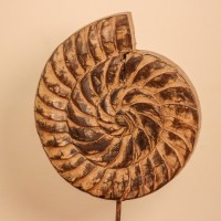 Carved wooden spiral block on stand styled on a console as table décor