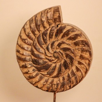 Carved wooden spiral block on stand styled on a console as table décor