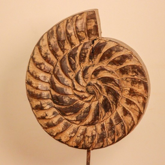 Carved wooden spiral block on stand styled on a console as table décor