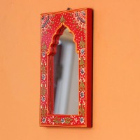 Jharokha Mirror Frame – Hand Painted Red Hand-carved wooden mirror frame in a jharokha arch shape, hand painted in red with a fine floral border in blue, green, and white, framing an arched mirror at the centre.
