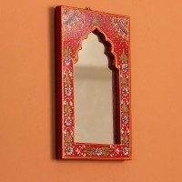 Jharokha Mirror Frame – Hand Painted Red Hand-carved wooden mirror frame in a jharokha arch shape, hand painted in red with a fine floral border in blue, green, and white, framing an arched mirror at the centre.