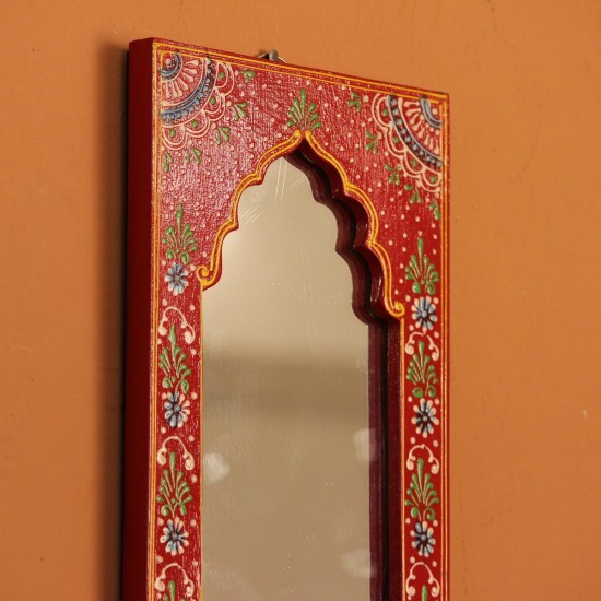 Jharokha Mirror Frame – Hand Painted Red Hand-carved wooden mirror frame in a jharokha arch shape, hand painted in red with a fine floral border in blue, green, and white, framing an arched mirror at the centre.