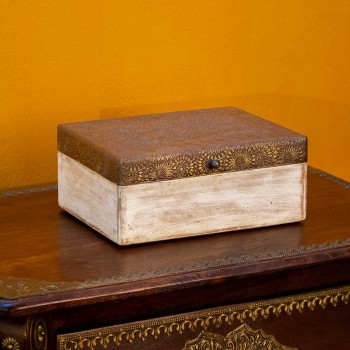 Distressed white wooden box with brass embossed top
