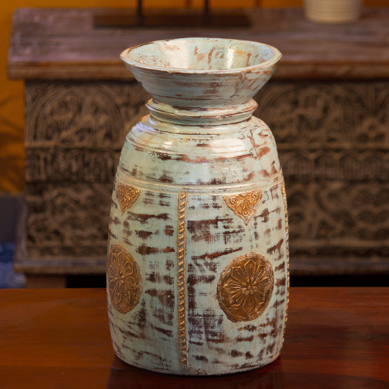 Distressed blue wooden matka with embossed brass work – rustic wooden pot front view Distressed blue wooden matka with embossed brass work – rustic wooden pot front view