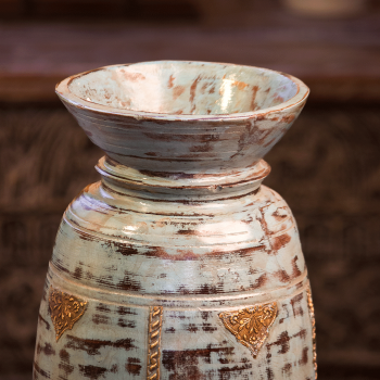 Distressed blue wooden matka with embossed brass work – rustic wooden pot front view Distressed blue wooden matka with embossed brass work – rustic wooden pot front view