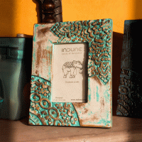 Artisan-crafted green wooden photo frame with rustic distressed finish Artisan-crafted green wooden photo frame with rustic distressed finish