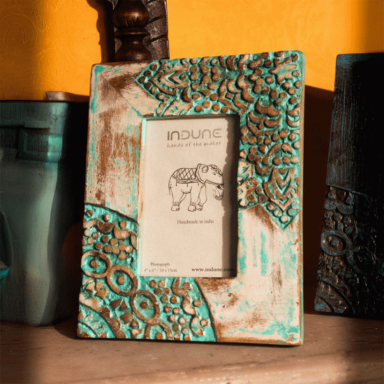 Artisan-crafted green wooden photo frame with rustic distressed finish Artisan-crafted green wooden photo frame with rustic distressed finish