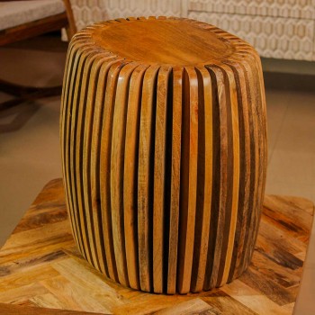 Handcrafted spiral slatted wooden stool with natural wood finish used as side table or accent stool