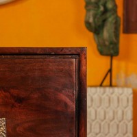 Premium dark wood two door cabinet with decorative embossed brass panels on the front