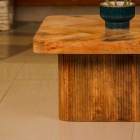 Wooden coffee table with chevron pattern tabletop and natural wood finish