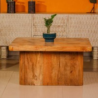 Large wooden coffee table with chevron pattern top and natural wood finish