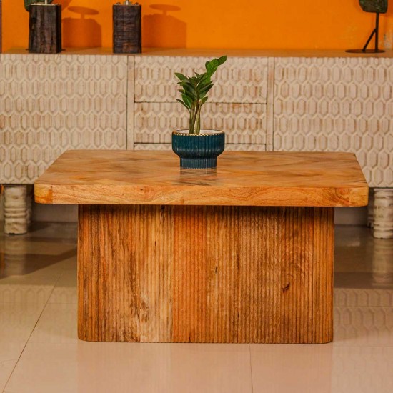 Large wooden coffee table with chevron pattern top and natural wood finish