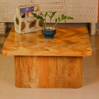 Large wooden coffee table with chevron pattern top and natural wood finish